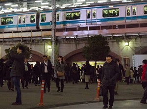 Workers returning to the home at Shinbashi station in Tokyo