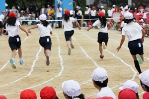 Some school children are running in the Athletic meet in an elementary school