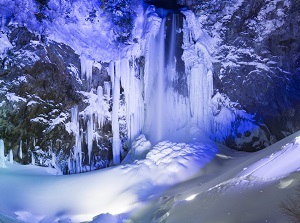 Illuminated frozen Hirayu Falls in winter