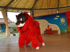 Performance of Lion dance in Okinawa World